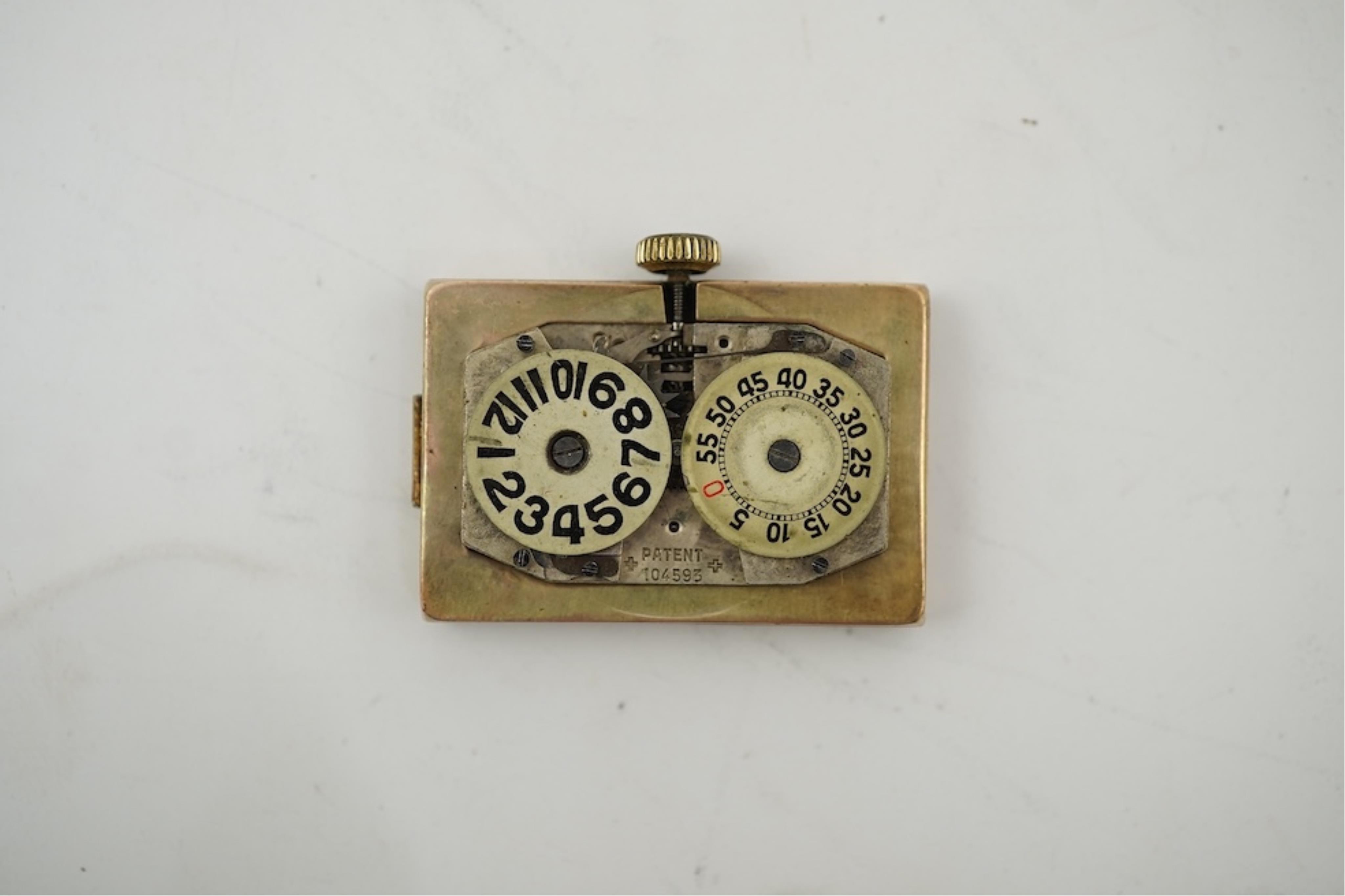 An early 1930's 9ct gold Swiss 'Jump Hour' rectangular cased manual wind wrist watch, case diameter 20mm, on a leather strap, gross weight 23 grams.